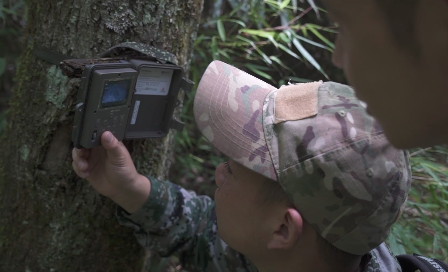 Laohegou Rangers checking photos